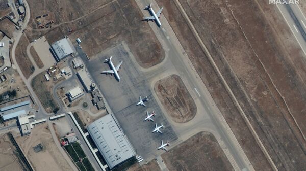 Six commercial airplanes are seen near the main terminal of the Mazar-i-Sharif airport, in northern Afghanistan, September 3 2021. Picture taken September 3, 2021. - Sputnik International