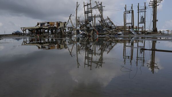 Damaged power lines and homes can be seen days after hurricane Ida ripped through Grand Isle, Louisiana, U.S., September 2, 2021. - Sputnik International