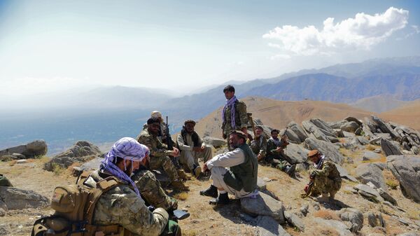  In this file photo taken on September 1, 2021, Afghan resistance movement and anti-Taliban uprising forces take rest as they patrol on a hilltop in Darband area in Anaba district of Panjshir province. - The Taliban said on September 6, 2021 the last pocket of resistance in Afghanistan, the Panjshir Valley, had been completely captured.  - Sputnik International