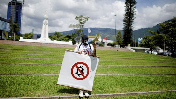 A man takes part in a protest against the use of Bitcoin as legal tender, in San Salvador, El Salvador, September 7, 2021. - Sputnik International