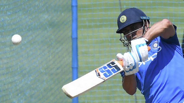 (FILES) In this file photo taken on March 7, 2019 Indian cricketer Mahendra Singh Dhoni bats at the nets during a training session ahead of the third one-day international (ODI) cricket match between India and Australia at the Jharkhand State Cricket Association International Cricket Stadium, in Ranchi - Sputnik International