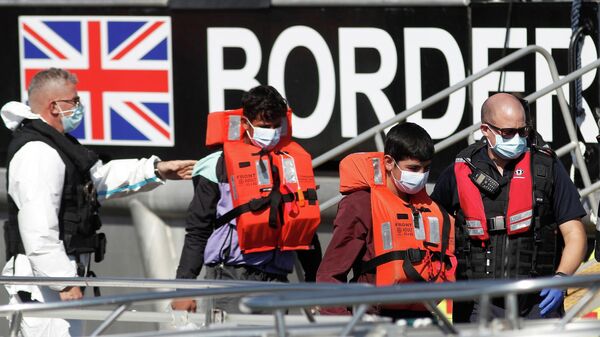 Migrants rescued from the English Channel are brought into Dover on the Border Force Catamaran Rescue Boat, BF Hurricane, Britain, September 8, 2021 - Sputnik International