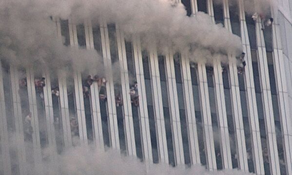 People hang out of broken windows of the North Tower of the World Trade Center after a terrorist attack in New York on the morning of 11 September 2001. - Sputnik International