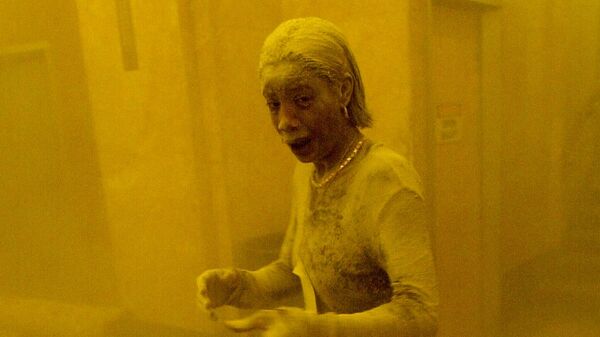 (FILES) In this file photo taken on September 11, 2001, Marcy Borders stands covered in dust as she takes refuge in an office building following the collapse of the twin towers of the World Trade Center in lower Manhattan, New York. - The remains of two more victims of 9/11 have been identified, thanks to advanced DNA technology, New York officials announced on September 8, 2021, just days before the 20th anniversary of the attacks - Sputnik International