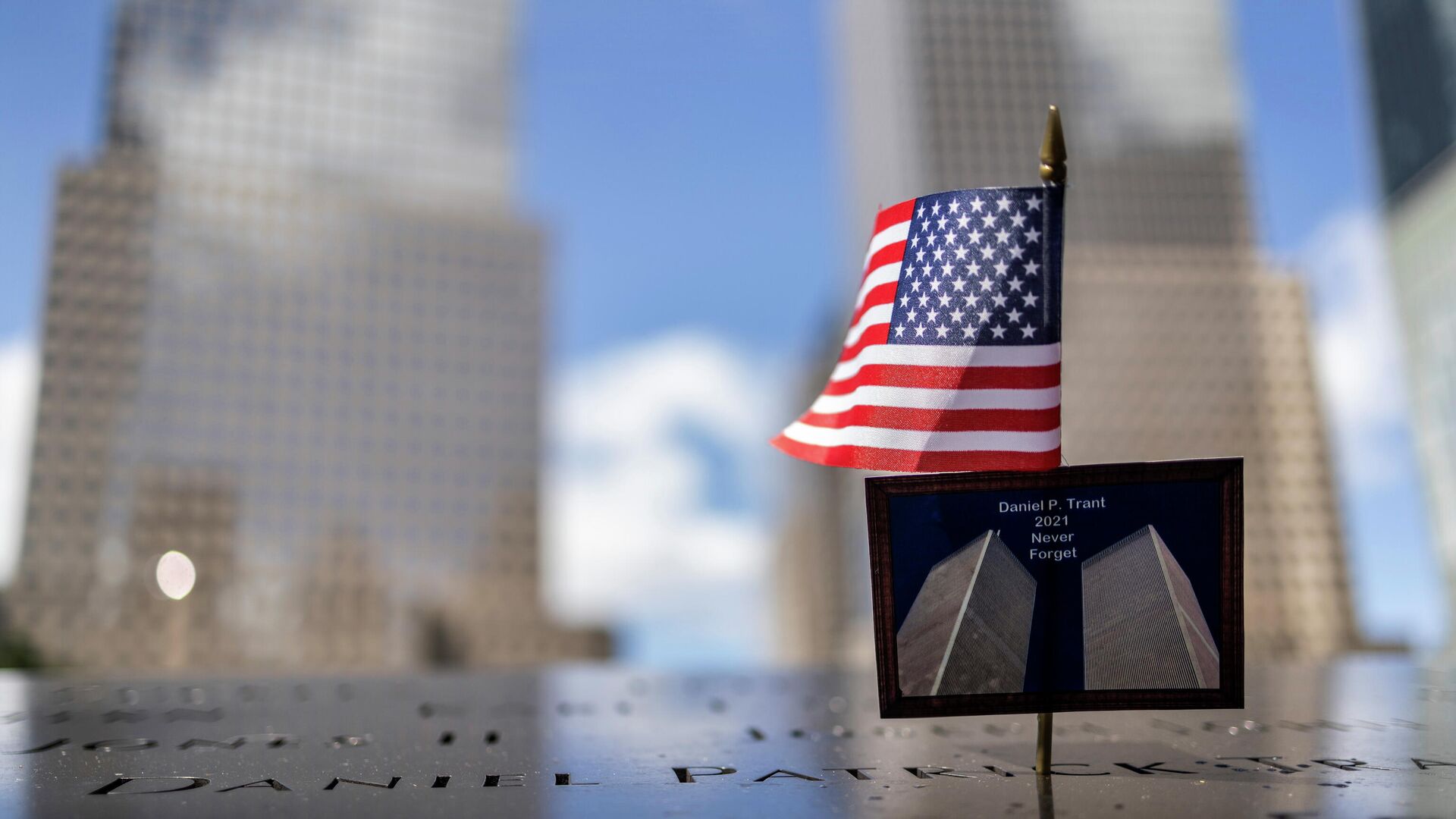 A postcard of the Twin Towers is seen at the 9/11 Memorial ahead of the 20th anniversary of the September 11 attacks in Manhattan, New York City, U.S., September 10, 2021. - Sputnik International, 1920, 11.09.2021