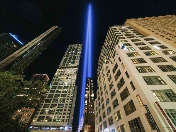 The annual &quot;Tribute in Light&quot; projects two pillars of light into the night sky next to the buildings overlooking the 9/11 Memorial &amp; Museum in New York City on 10 September 2021. - Sputnik International