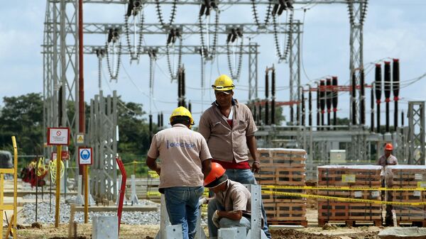 Employees of the Venezuelan national electricity company are pictured inside an electric plant in San Fernando de Apure (southern Venezuela) on October 2, 2008 - Sputnik International