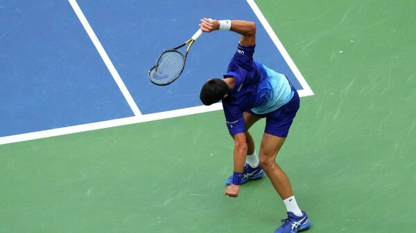 Sep 12, 2021; Flushing, NY, USA; Novak Djokovic of Serbia smashes his racket after losing a point to Daniil Medvedev of Russia in the second set of the men's singles final on day fourteen of the 2021 U.S. Open tennis tournament at USTA Billie Jean King National Tennis Center - Sputnik International