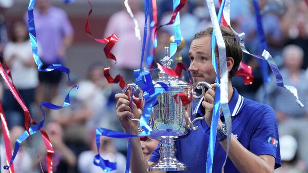 Daniil Medvedev of Russia celebrates with the championship trophy after his match against Novak Djokovic of Serbia (not pictured) in the men's singles final on day fourteen of the 2021 U.S. Open tennis tournament at USTA Billie Jean King National Tennis Center. - Sputnik International
