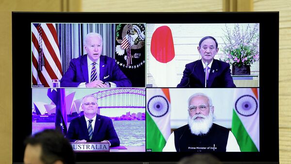 A monitor displaying a virtual meeting with U.S. President Joe Biden (top L), Australia's Prime Minister Scott Morrison (bottom L), Japan's Prime Minister Yoshihide Suga (top R) and India's Prime Minister Narendra Modi is seen during the virtual Quadrilateral Security Dialogue (Quad) meeting, at Suga's official residence in Tokyo on March 12, 2021. - Sputnik International