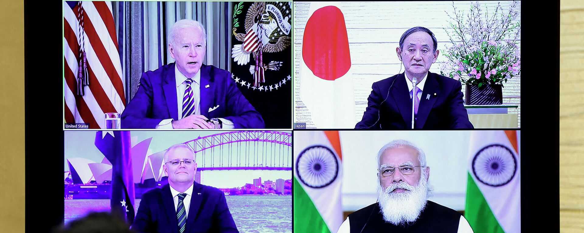 A monitor displaying a virtual meeting with U.S. President Joe Biden (top L), Australia's Prime Minister Scott Morrison (bottom L), Japan's Prime Minister Yoshihide Suga (top R) and India's Prime Minister Narendra Modi is seen during the virtual Quadrilateral Security Dialogue (Quad) meeting, at Suga's official residence in Tokyo on March 12, 2021. - Sputnik International, 1920, 25.09.2021