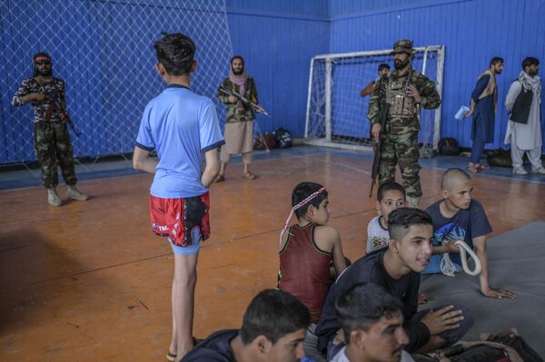 Children wait to show their skills during an event organised for the visit of the Taliban&#x27;s director of physical education and sports, Bashir Ahmad Rustamzai (not pictured), at a gymnasium in Kabul on 14 September 2021. From swimming to soccer, running to horse-riding, Afghanistan&#x27;s new sports chief said on 14 September that the Taliban will allow 400 sports -- but declined to confirm if women can play a single one. - Sputnik International
