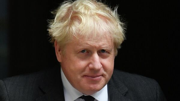 Britain's PM Johnson walks outside Downing Street in London - Sputnik International