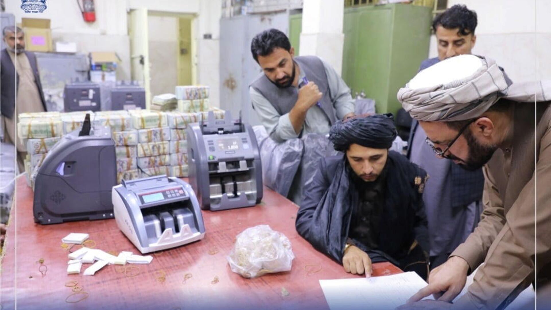 Men are pictured as Afghanistan's Taliban-controlled central bank seizes a large amount of money in cash and gold from former top government officials, including former vice president Amrullah Saleh, in Afghanistan, in this handout obtained by Reuters on September 15, 2021 - Sputnik International, 1920, 12.10.2021