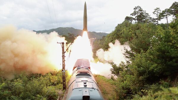 A missile is seen launched during a drill of the Railway Mobile Missile Regiment in North Korea, in this image supplied by North Korea's Korean Central News Agency on September 16, 2021 - Sputnik International