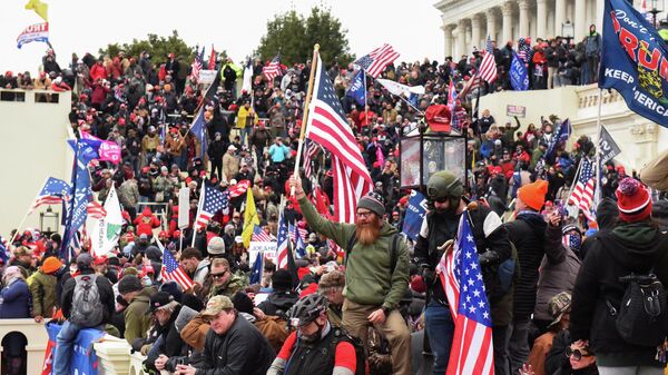 Supporters of U.S. President Donald Trump gather in front of the U.S. Capitol Building in Washington, U.S. January 6, 2021 - Sputnik International