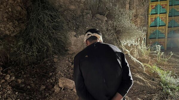 Palestinian militant Mahmoud Ardah sits after being arrested, following his escape from Gilboa prison together with five other militants, in the village of Umm Al Ghanam, Israel September 11, 2021 - Sputnik International