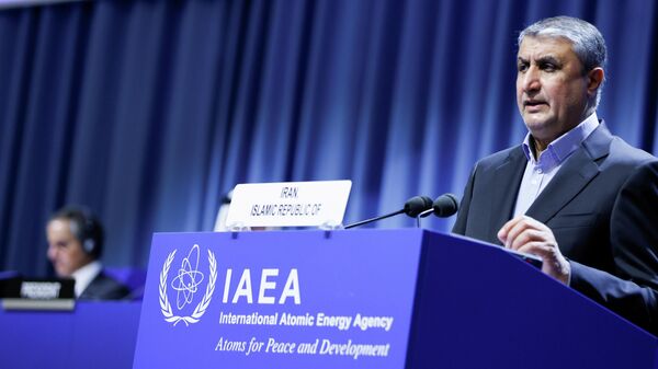 Iranian Atomic Energy Agency (IAEA) Chief Mohammad Eslami delivers his speech as IAEA Director General Rafael Grossi listens at the opening of the IAEA General Conference at their headquarters in Vienna, Austria, September 20, 2021 - Sputnik International
