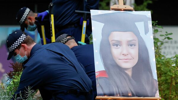 A portrait of Sabina Nessa, a teacher who was murdered in Pegler Square, is seen as police officers search the area prior to a vigil, in London, Britain September 24, 2021.  - Sputnik International