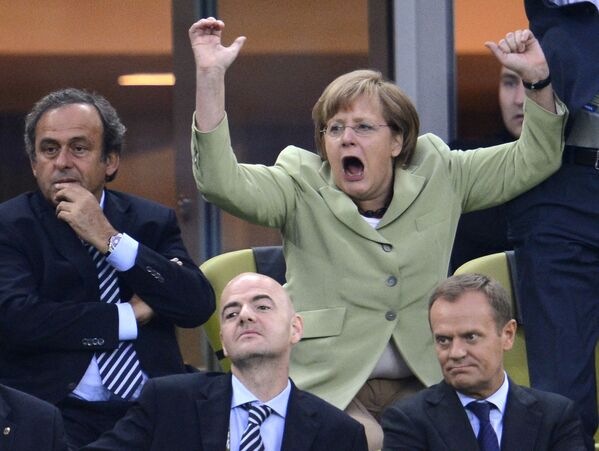  German Chancellor Angela Merkel celebrates a goal, scored by Philip Lahm during a Euro 2012 match between Germany and Greece at Stadion Gdansk. 22 June 2012. - Sputnik International