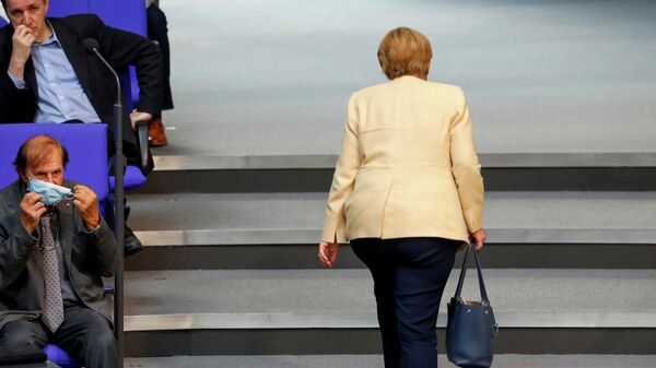 German Chancellor Angela Merkel leaves the plenary hall of the lower house of Parliament, or Bundestag, during one of the last sessions before the federal elections in Berlin, Germany, on 7 September 2021. - Sputnik International
