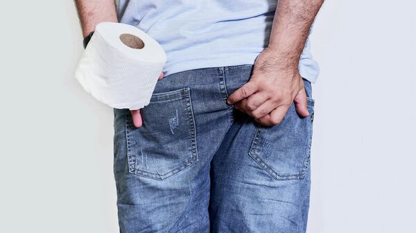  A man suffers from diarrhea and holds toilet paper roll  - Sputnik International