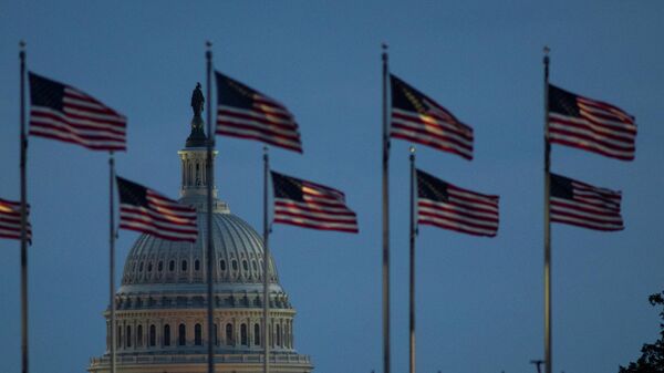 The U.S. Capitol building is seen illuminated at dawn along the National Mall in Washington, U.S., September 29, 2021.  - Sputnik International