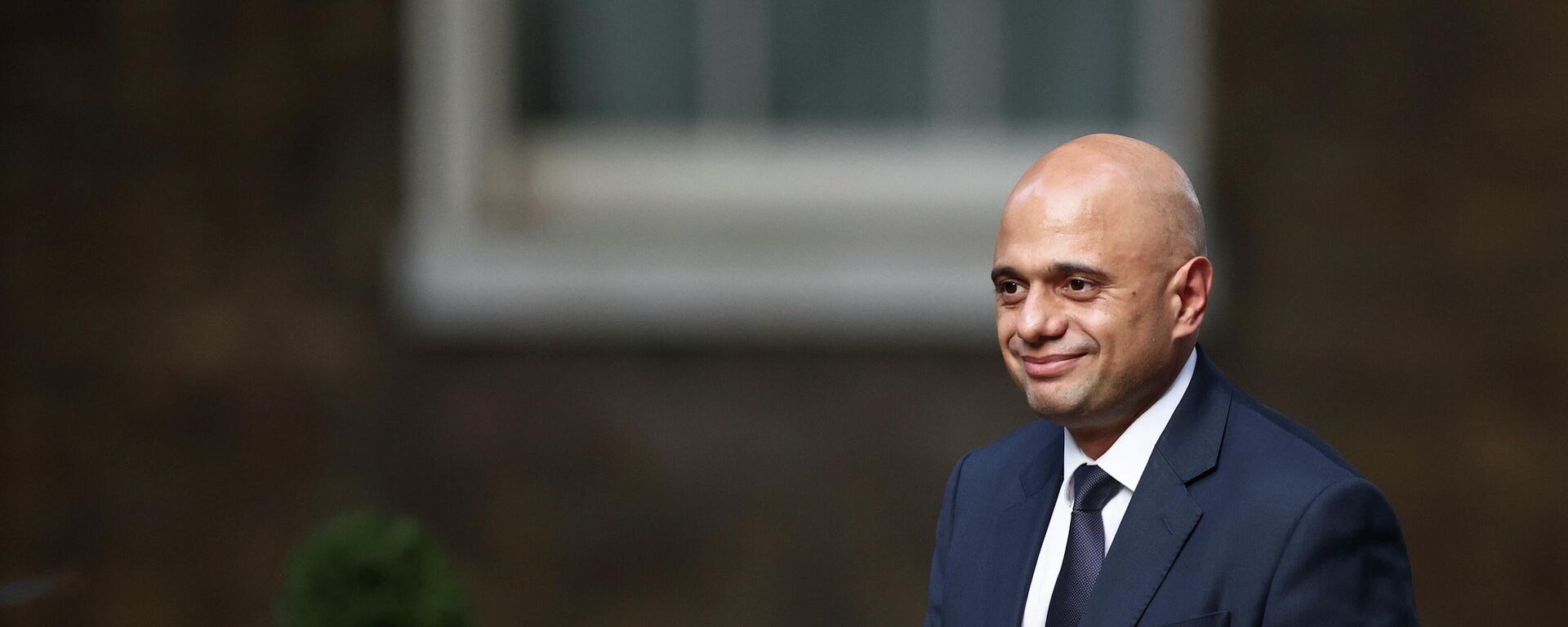 Britain's Secretary of State for Health and Social Care Sajid Javid walks outside Downing Street in London - Sputnik International, 1920, 02.10.2021