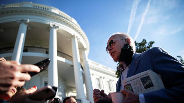 U.S. President Joe Biden speaks to reporters as he departs for a trip to Wilmington, Delaware, on the South Lawn of the White House, in Washington, U.S., October 2, 2021 - Sputnik International