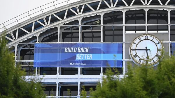A political banner hangs on the outside of the Manchester Central Convention Complex at the annual Conservative party conference in Manchester - Sputnik International