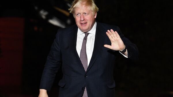 Britain's Prime Minister Boris Johnson arrives at The Midland Hotel ahead of the annual Conservative Party Conference being held at the Manchester Central convention centre in Manchester, on October 2, 2021 - Sputnik International