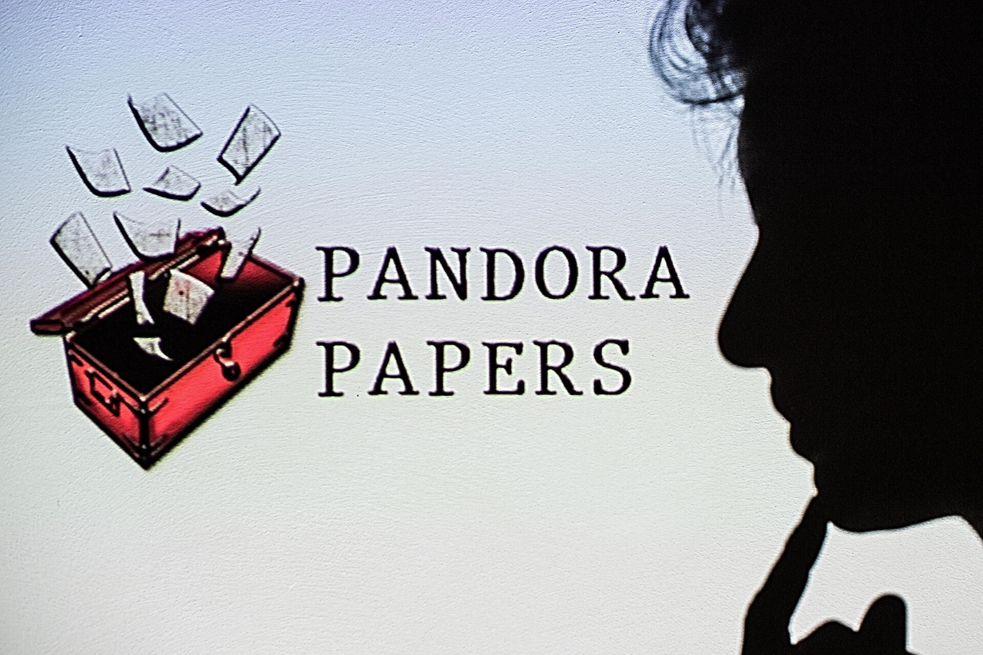 This photograph illustration shows a woman's shadow cast on the logo of Pandora Papers, in Lavau-sur-Loire, western France, on October 4, 2021 - Sputnik International, 1920, 04.10.2021