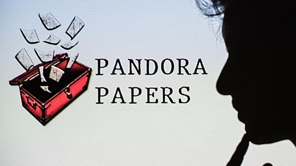 This photograph illustration shows a woman's shadow cast on the logo of Pandora Papers, in Lavau-sur-Loire, western France, on October 4, 2021 - Sputnik International