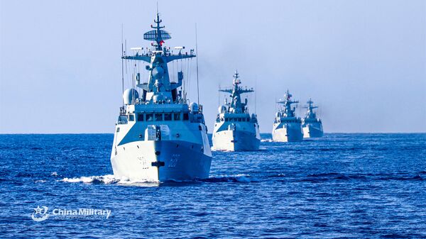 The frigate Enshi (Hull 627), Yongzhou (Hull 628), Bazhong (Hull 625), and Wuzhou (Hull 626) steam in formation during a 9-day maritime training exercise in waters of the South China Sea in late November, 2020. They are attached to a frigate flotilla of the navy under the PLA Southern Theater Command. - Sputnik International