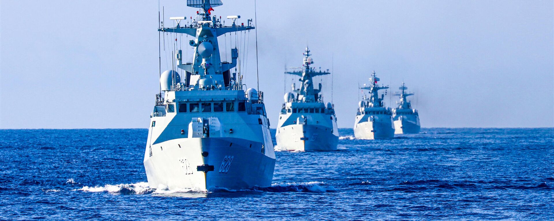 The frigate Enshi (Hull 627), Yongzhou (Hull 628), Bazhong (Hull 625), and Wuzhou (Hull 626) steam in formation during a 9-day maritime training exercise in waters of the South China Sea in late November, 2020. They are attached to a frigate flotilla of the navy under the PLA Southern Theater Command. - Sputnik International, 1920, 26.09.2023