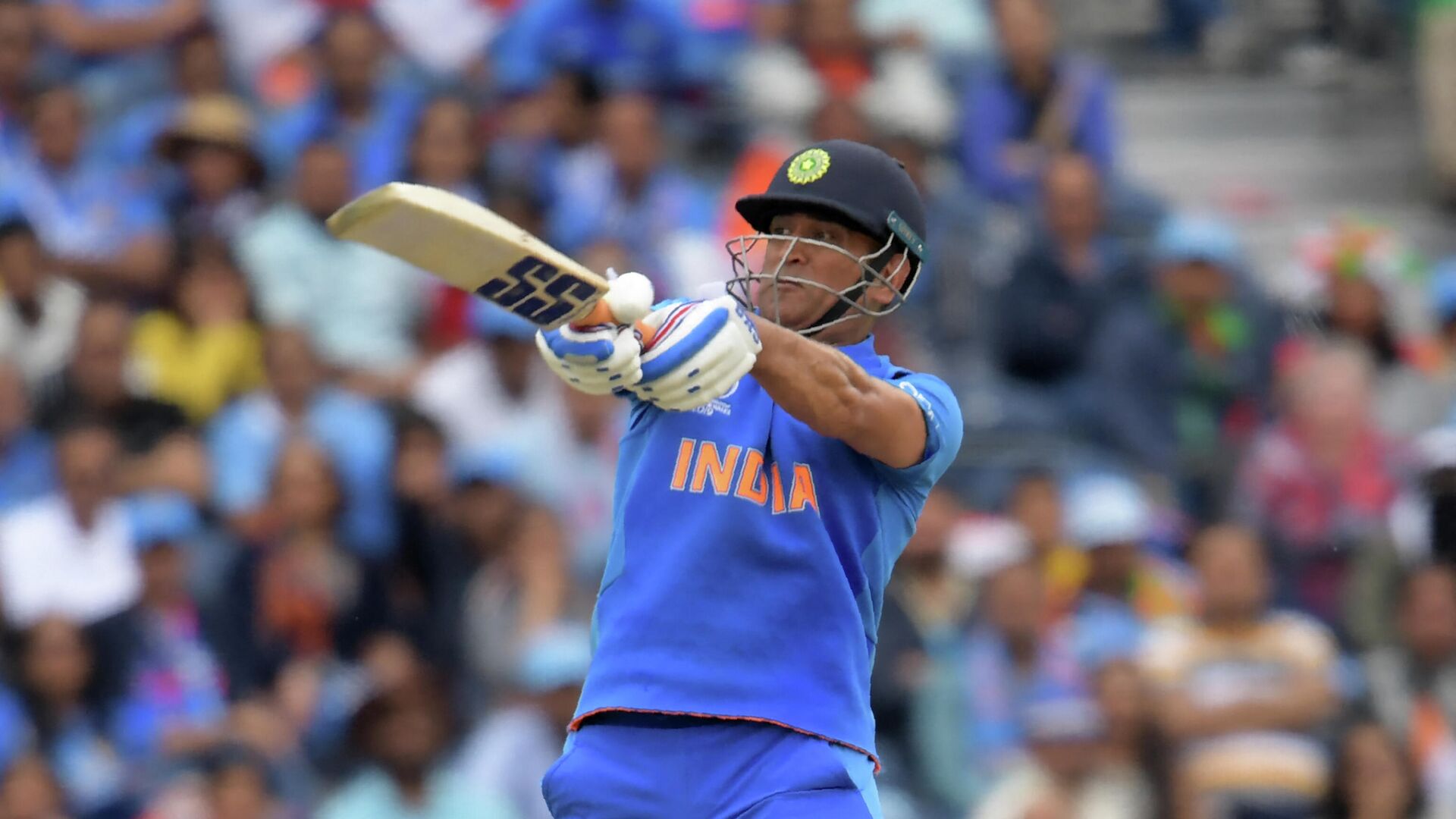 India's Mahendra Singh Dhoni plays a shot during the 2019 Cricket World Cup first semi-final between New Zealand and India at Old Trafford in Manchester, northwest England, on July 10, 2019 - Sputnik International, 1920, 05.10.2021