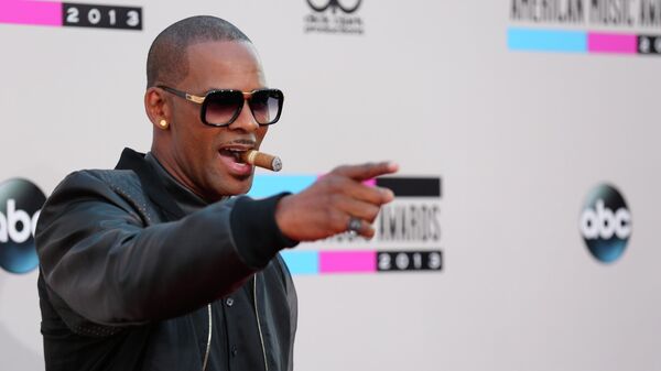 FILE - In this Sunday, Nov. 24, 2013, file photo, R. Kelly arrives at the 2013 American Music Awards, in Los Angeles. A federal jury in New York convicted the R&B superstar Monday, Sept. 27, 2021, in a sex trafficking trial - Sputnik International