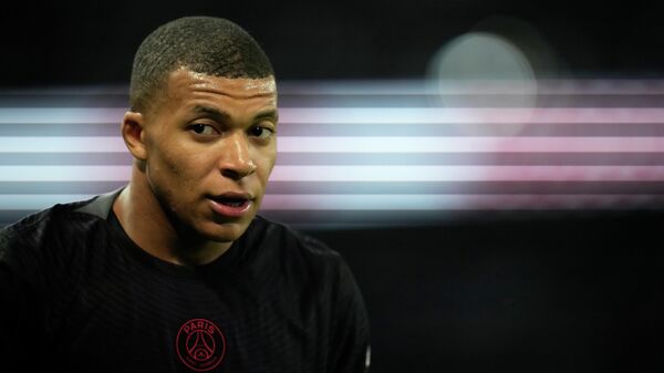 PSG's Kylian Mbappe looks on during the French League One soccer match between Paris Saint-Germain and Montpellier at the Parc des Princes stadium in Paris, Saturday, Sept. 25, 2021 - Sputnik International