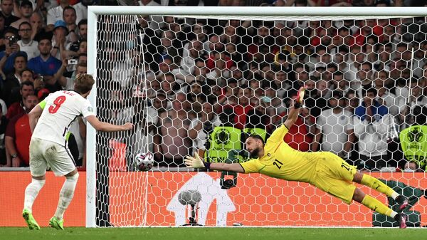 England's Harry Kanem left, shoots to score past Italy's goalkeeper Gianluigi Donnarumma during penalty shootout of the Euro 2020 soccer championship final match between England and Italy at Wembley Stadium in London, Sunday, July 11, 2021 - Sputnik International