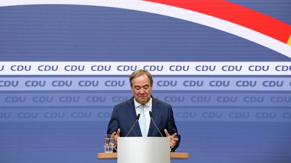 Armin Laschet, the leader of Angela Merkel's conservative Christian Democratic Union party CDU, looks down as he gives a statement on talk to form a German government at the CDU headquarters in Berlin, Germany, October 7, 2021. - Sputnik International