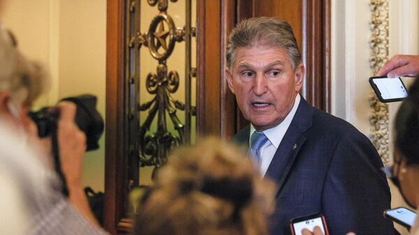 U.S. Senator Joe Manchin (D-WV) faces reporters after it was announced that the U.S. Senate reached a deal to pass a $480 billion increase in Treasury Department borrowing authority, at the U.S. Capitol in Washington, U.S., October 7, 2021. - Sputnik International