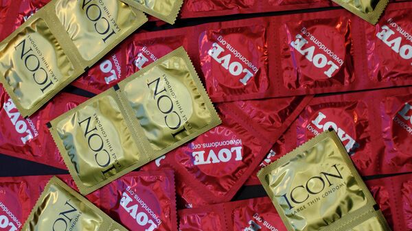 This Feb. 14, 2013 file photo, a sample of condoms distributed freely by the AIDS Healthcare Foundation in 28 countries is displayed at a news conference at the AHF headquarters in Los Angeles.  - Sputnik International