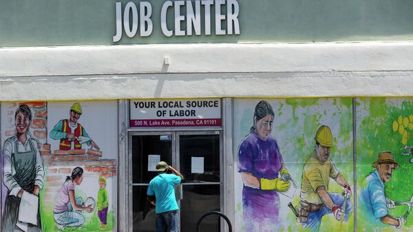 In this May 7, 2020, file photo, a person looks inside the closed doors of the Pasadena Community Job Center during the coronavirus outbreak in Pasadena, Calif. - Sputnik International