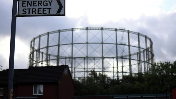 FILE PHOTO: A disused gas holder is seen behind a road sign for Energy Street in Manchester - Sputnik International