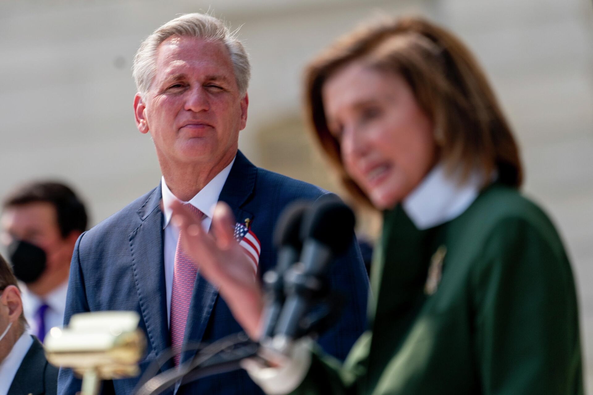House Speaker Nancy Pelosi of Calif., right, accompanied by House Minority Leader Kevin McCarthy of Calif., left, speaks during a Congressional Remembrance Ceremony marking the 20th anniversary of the Sept. 11, 2001, terrorist attacks, on Capitol Hill in Washington, Monday, Sept. 13, 2021. - Sputnik International, 1920, 21.10.2022