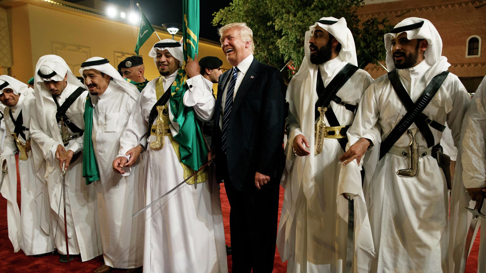 In this May 20, 2017 file photo, U.S. President Donald Trump holds a sword and dances with traditional dancers during a welcome ceremony at Murabba Palace, in Riyadh. - Sputnik International, 1920, 12.10.2021