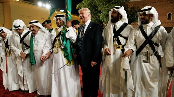 In this May 20, 2017 file photo, U.S. President Donald Trump holds a sword and dances with traditional dancers during a welcome ceremony at Murabba Palace, in Riyadh. - Sputnik International