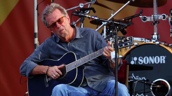 In this April 27, 2014 file photo, Eric Clapton performs at the 2014 New Orleans Jazz & Heritage Festival at Fair Grounds Race Course  in New Orleans. - Sputnik International