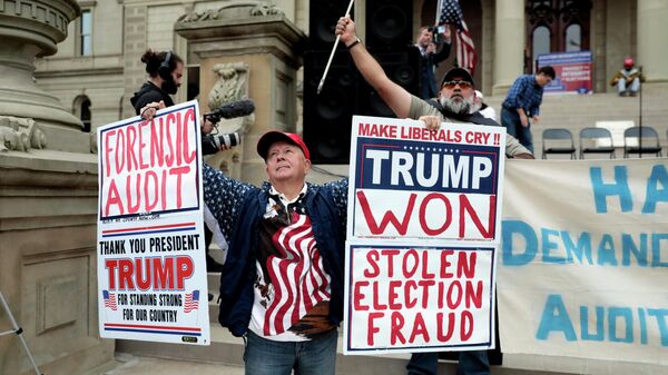 Supporters of former U.S. President Donald Trump gather outside the Michigan State Capitol to demand an audit of 2020 election votes, in Lansing, Michigan, U.S. October 12, 2021. - Sputnik International