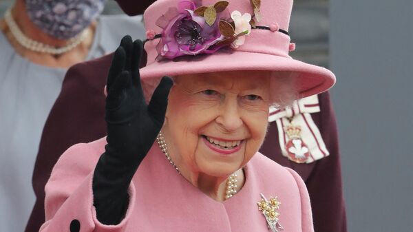 Britain's Queen Elizabeth II gestures on her departure after attending the ceremonial opening of the sixth Senedd, in Cardiff, Wales on October 14, 2021 - Sputnik International